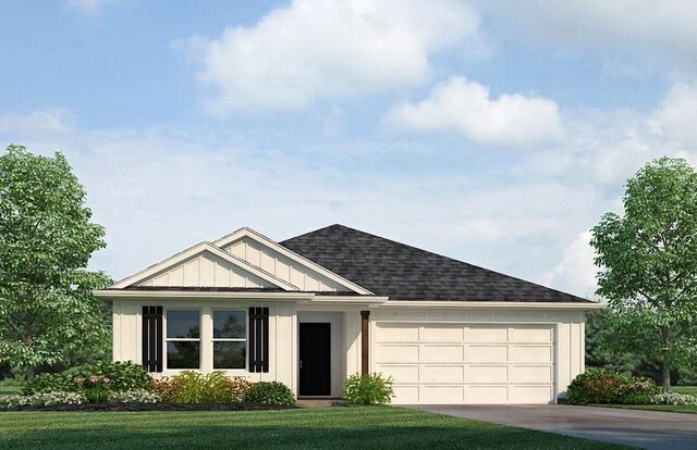 317 Holmes Blvd, Terrytown, LA 70056 - view of front of property featuring a garage, concrete driveway, roof with shingles, board and batten siding, and a front yard