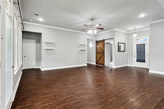 44128 Halter Ln, Hammond, LA 70403 - unfurnished living room with a barn door, dark wood-style floors, a ceiling fan, recessed lighting, and crown molding