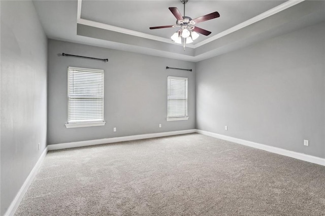 44128 Halter Ln, Hammond, LA 70403 - carpeted spare room with a raised ceiling, ornamental molding, and a ceiling fan