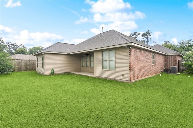 44128 Halter Ln, Hammond, LA 70403 - rear view of property featuring a fenced backyard, a patio, brick siding, and roof with shingles