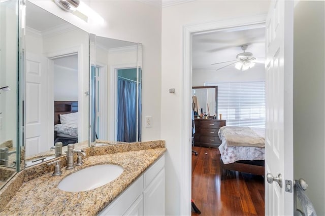 647 Highland Oaks Dr, Baton Rouge, LA 70810 - bathroom with ensuite bath, crown molding, wood finished floors, ceiling fan, and vanity