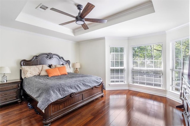 647 Highland Oaks Dr, Baton Rouge, LA 70810 - bedroom with a tray ceiling, dark wood-style flooring, crown molding, and ceiling fan