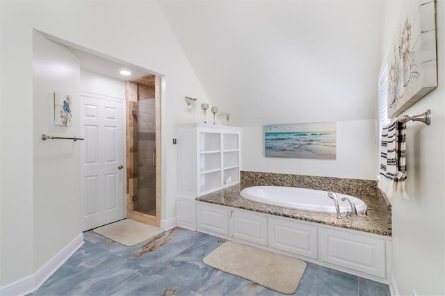 647 Highland Oaks Dr, Baton Rouge, LA 70810 - full bath featuring a stall shower, a garden tub, and vaulted ceiling