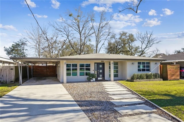 525 Bellview St, River Ridge, LA 70123 - view of front of property with stucco siding, concrete driveway, and an attached carport