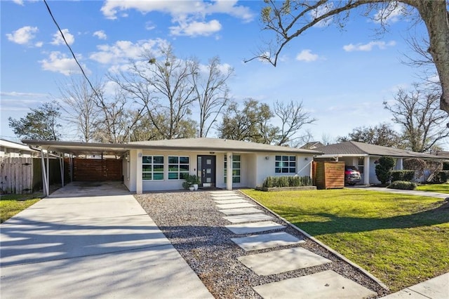 525 Bellview St, River Ridge, LA 70123 - view of front of home featuring concrete driveway, an attached carport, and stucco siding