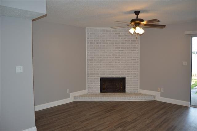 222 Putters Ln Unit 39, Slidell, LA 70460 - unfurnished living room with ceiling fan, wood finished floors, and a fireplace
