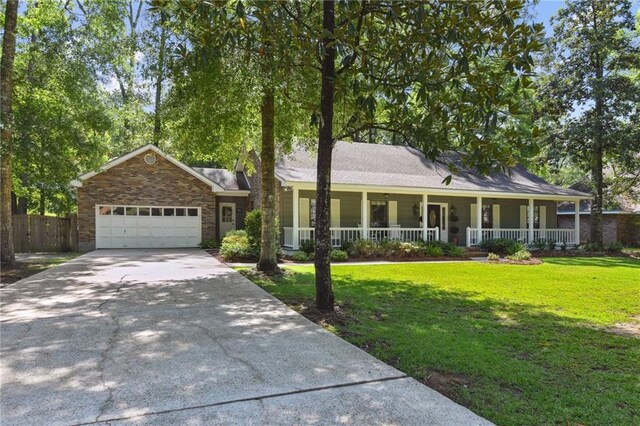 103 Century Oaks Ln, Mandeville, LA 70471 - ranch-style home with a porch, driveway, and a garage