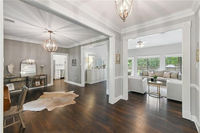 103 Century Oaks Ln, Mandeville, LA 70471 - entryway featuring a chandelier, wood finished floors, a ceiling fan, and crown molding