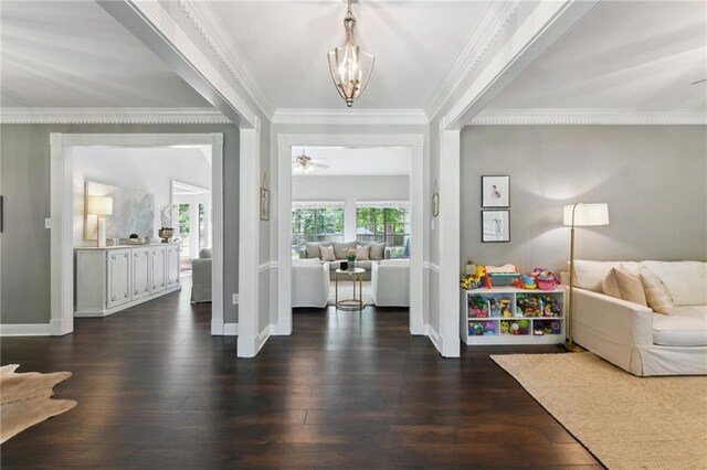 103 Century Oaks Ln, Mandeville, LA 70471 - foyer entrance featuring a chandelier, ornamental molding, and dark wood finished floors
