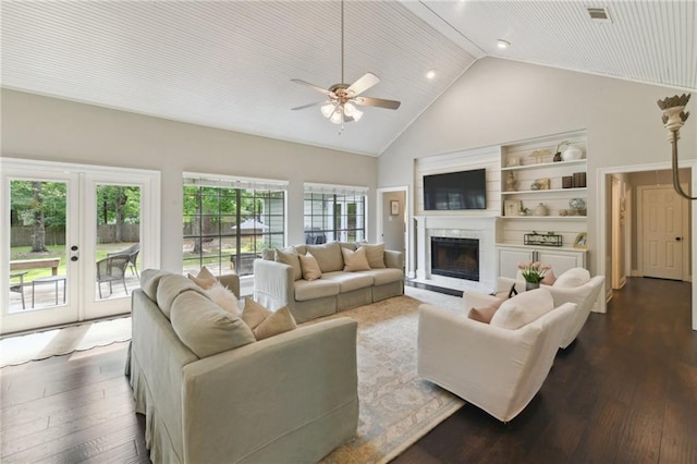 103 Century Oaks Ln, Mandeville, LA 70471 - living room with dark wood finished floors, a ceiling fan, a premium fireplace, french doors, and high vaulted ceiling