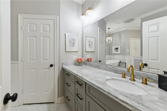 103 Century Oaks Ln, Mandeville, LA 70471 - bathroom featuring vanity, crown molding, and a freestanding tub