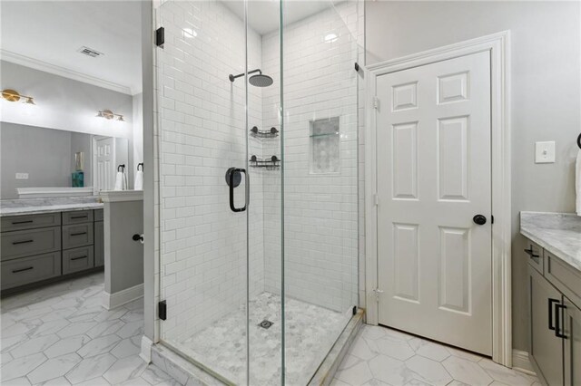 103 Century Oaks Ln, Mandeville, LA 70471 - bathroom with vanity, a shower stall, and ornamental molding