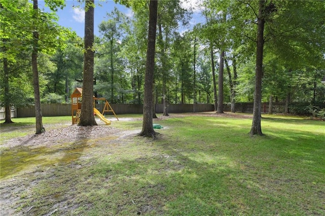 103 Century Oaks Ln, Mandeville, LA 70471 - view of yard with a playground and view of scattered trees
