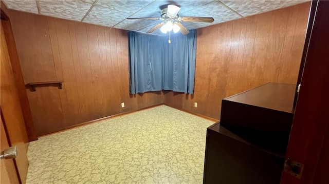 217 Evangeline Rd, Montz, LA 70068 - spare room featuring ceiling fan and wooden walls