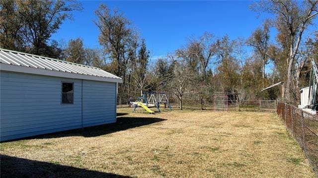 217 Evangeline Rd, Montz, LA 70068 - view of yard featuring an outbuilding and a playground