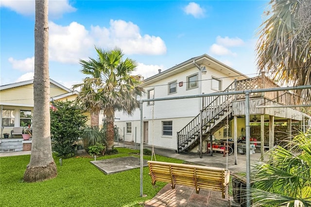 400 Aris Ave, Metairie, LA 70005 - rear view of property featuring stairway, a yard, a patio, and a deck