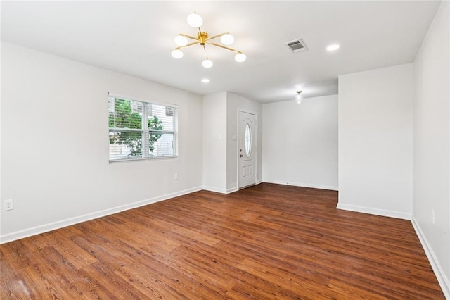 802 Claiborne Dr, Jefferson, LA 70121 - unfurnished room featuring a chandelier, dark wood-style floors, and recessed lighting