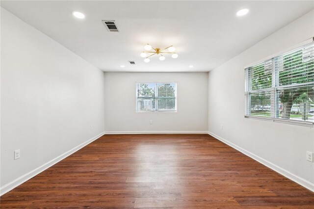 802 Claiborne Dr, Jefferson, LA 70121 - spare room with a chandelier, dark wood-type flooring, and recessed lighting