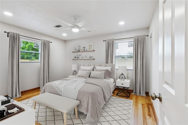 802 Claiborne Dr, Jefferson, LA 70121 - bedroom with multiple windows, light wood-style floors, recessed lighting, and a ceiling fan