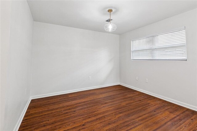 802 Claiborne Dr, Jefferson, LA 70121 - empty room with baseboards and dark wood-style floors