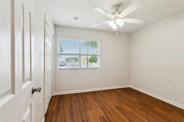 802 Claiborne Dr, Jefferson, LA 70121 - unfurnished bedroom with dark wood-style floors, a closet, and a ceiling fan