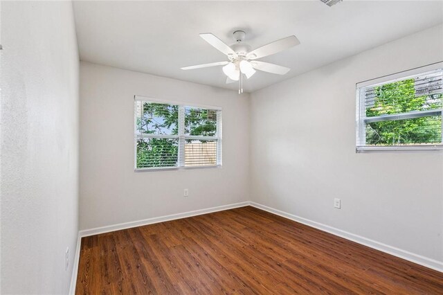 802 Claiborne Dr, Jefferson, LA 70121 - spare room featuring healthy amount of natural light, dark wood finished floors, and a ceiling fan