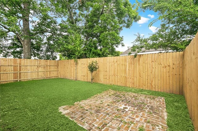 802 Claiborne Dr, Jefferson, LA 70121 - fenced backyard with a patio