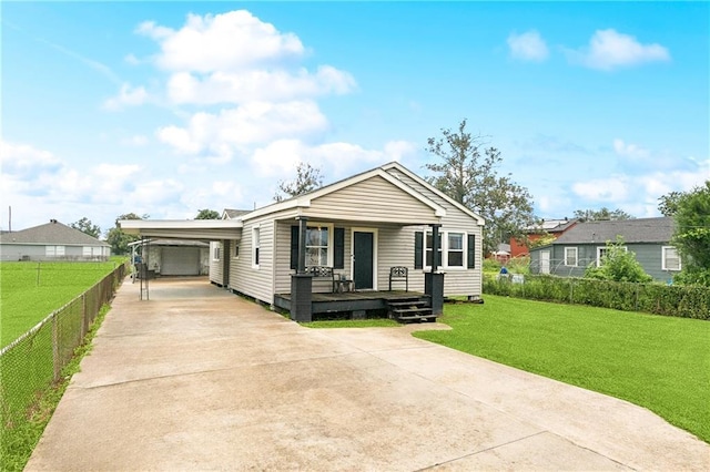 413 Fir St, La Place, LA 70068 - view of front of home with driveway, covered porch, and an attached carport