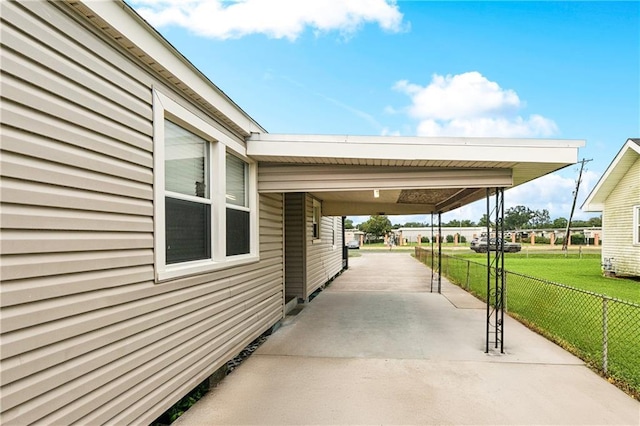 413 Fir St, La Place, LA 70068 - view of patio featuring driveway and a carport