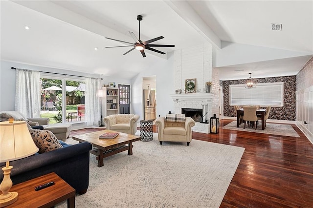 400 W Lake Catahoula Ct, Slidell, LA 70461 - living area featuring ceiling fan, wood finished floors, a brick fireplace, and a chandelier