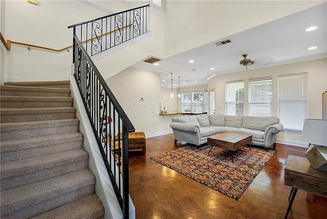 8000 Stonelake Village Ave Unit 406, Baton Rouge, LA 70820 - living area featuring concrete floors, stairway, recessed lighting, crown molding, and a high ceiling