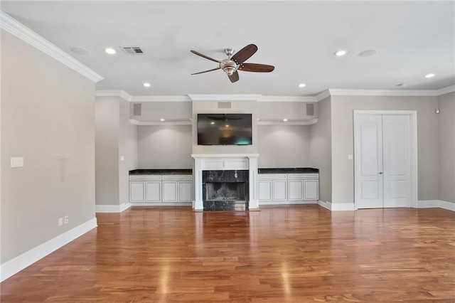 152 Portland St, New Orleans, LA 70124 - unfurnished living room featuring ceiling fan, recessed lighting, wood finished floors, a fireplace, and ornamental molding