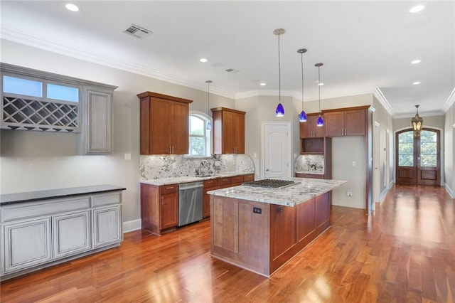 152 Portland St, New Orleans, LA 70124 - kitchen with stainless steel appliances, wood finished floors, french doors, backsplash, and light stone countertops