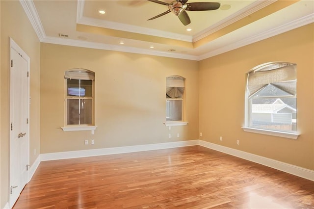 152 Portland St, New Orleans, LA 70124 - unfurnished room with wood finished floors, a raised ceiling, ceiling fan, and ornamental molding