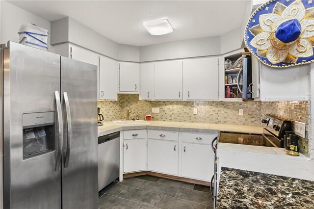2305 Cleary Ave Unit 225, Metairie, LA 70001 - kitchen with appliances with stainless steel finishes, white cabinetry, backsplash, and open shelves