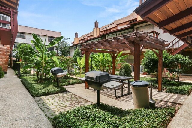 2305 Cleary Ave Unit 225, Metairie, LA 70001 - view of patio featuring a pergola and grilling area