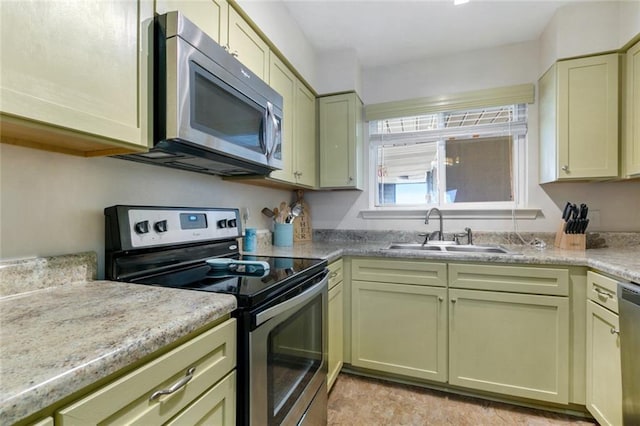 1244 Harbor Dr Unit 321, Slidell, LA 70458 - kitchen with stainless steel appliances, green cabinets, and light countertops