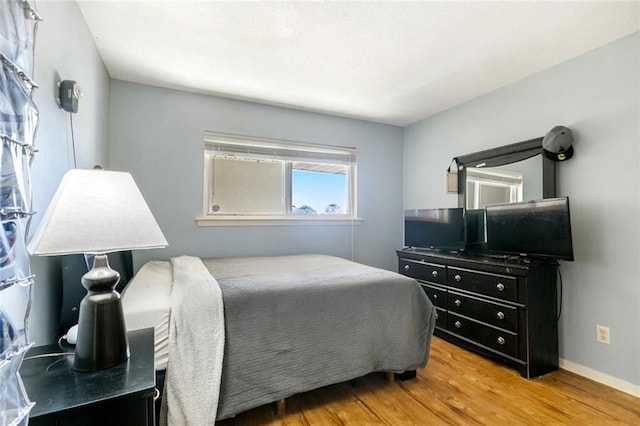 1244 Harbor Dr Unit 321, Slidell, LA 70458 - bedroom featuring light wood-style floors and baseboards