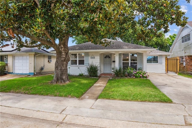 1213 Focis St, Metairie, LA 70005 - bungalow with concrete driveway, a front lawn, and brick siding