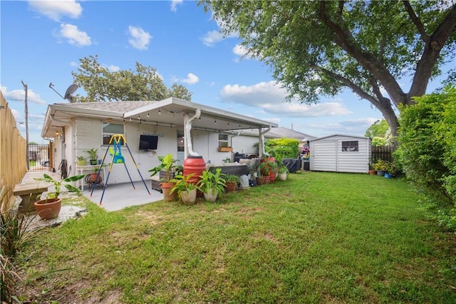 1213 Focis St, Metairie, LA 70005 - back of house featuring a storage unit, a patio, and a fenced backyard