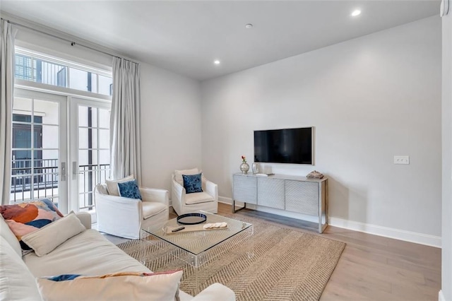 731 St Charles Ave Unit 304, New Orleans, LA 70130 - living room featuring wood finished floors and recessed lighting