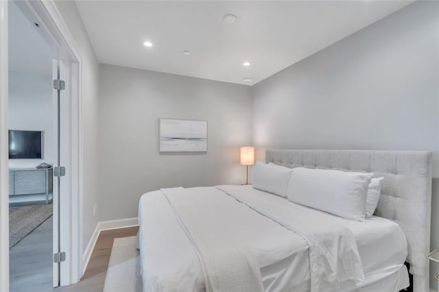 731 St Charles Ave Unit 304, New Orleans, LA 70130 - bedroom featuring wood finished floors and recessed lighting
