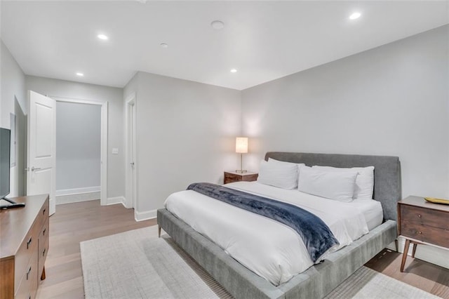 731 St Charles Ave Unit 304, New Orleans, LA 70130 - bedroom featuring light wood-style flooring and recessed lighting