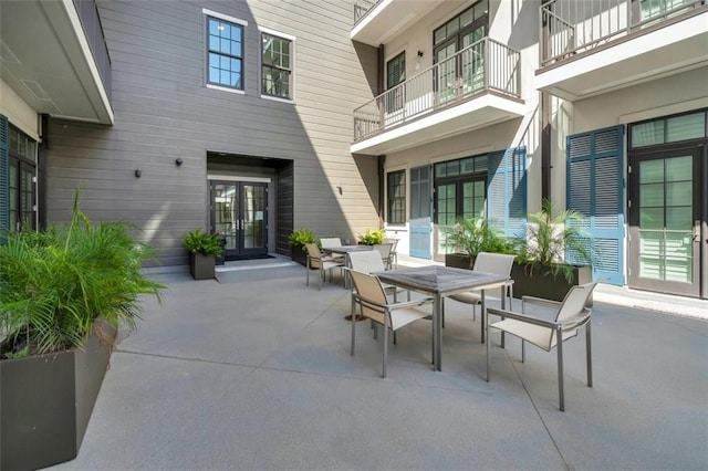 731 St Charles Ave Unit 304, New Orleans, LA 70130 - view of patio with outdoor dining area and french doors