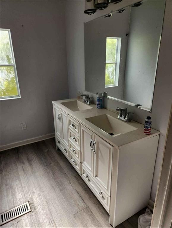 116 Cedar Dr, Belle Chasse, LA 70037 - full bath with double vanity and wood finished floors