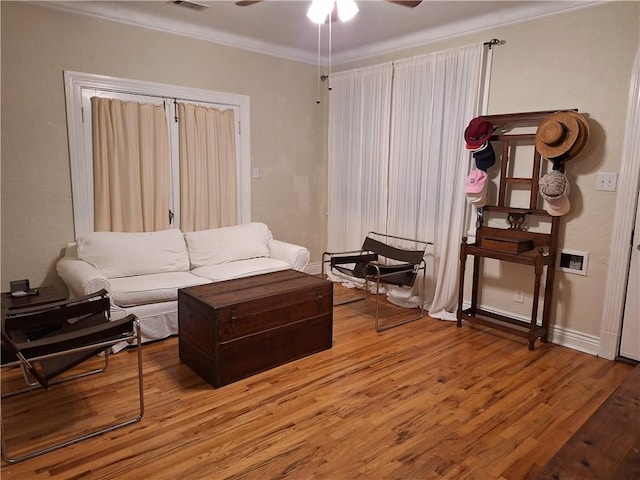 4712 Lafaye St, New Orleans, LA 70122 - living room with crown molding, ceiling fan, and light wood-type flooring