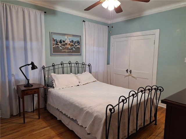 4712 Lafaye St, New Orleans, LA 70122 - bedroom with wood finished floors, crown molding, a closet, and ceiling fan