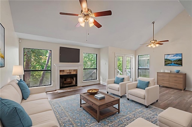 34 Chamale Cv Unit 34, Slidell, LA 70460 - living room with ceiling fan, wood finished floors, a tile fireplace, and high vaulted ceiling