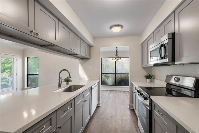 34 Chamale Cv Unit 34, Slidell, LA 70460 - kitchen featuring appliances with stainless steel finishes, gray cabinetry, and light countertops