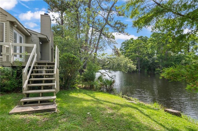 34 Chamale Cv Unit 34, Slidell, LA 70460 - view of grassy yard with stairs and a deck with water view